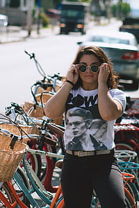 woman standing beside brown commuter bike thumbnail