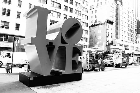 grayscale photography of love freestanding letter on sidewalk thumbnail