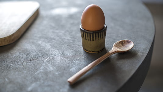 poultry egg beside brown spoon thumbnail