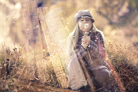 girl blowing dandelion thumbnail
