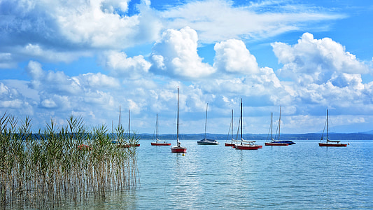 landscape photo of boat with clear blue skies thumbnail