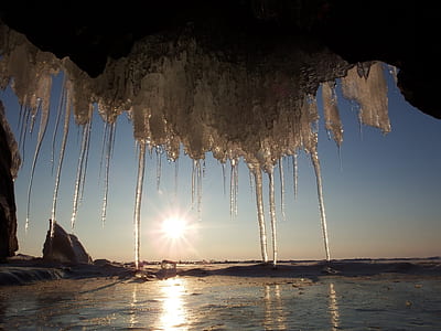 icicles under cliff during daytime thumbnail