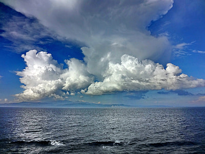 body of water under cloudy sky at daytime thumbnail