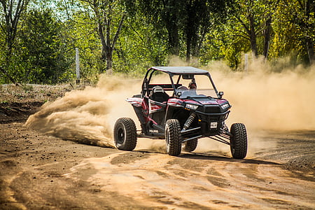 UTV on race track beside trees thumbnail