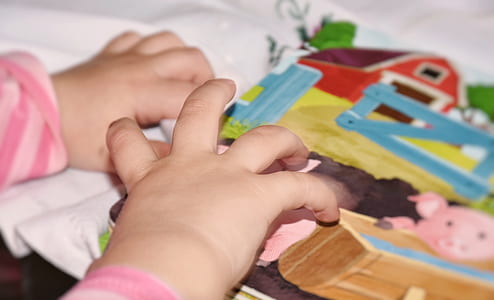 child holding textile thumbnail