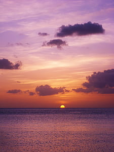 sunset under purple and orange skies thumbnail