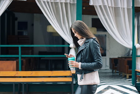 woman holding smartphone thumbnail