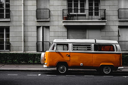 white and orange Volkswagen combi on roadside thumbnail