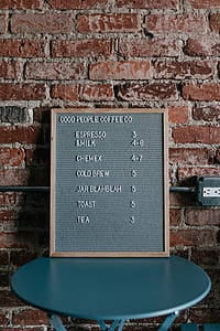 gray sign board on table thumbnail