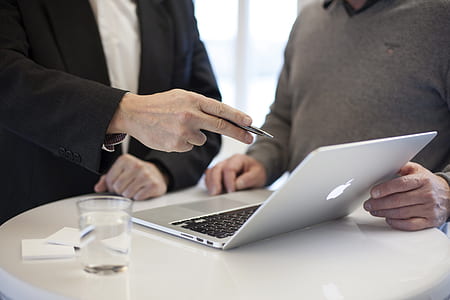 person pointing on MacBook Pro thumbnail