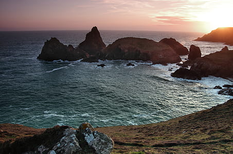 Photo of Rock Formation Surrounded by Water thumbnail