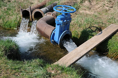 water flows thru pipe and river thumbnail