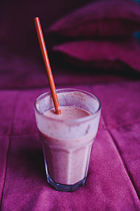 Fresh and healthy fruit milkshake with a straw thumbnail