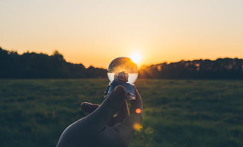 person holding snow globe thumbnail