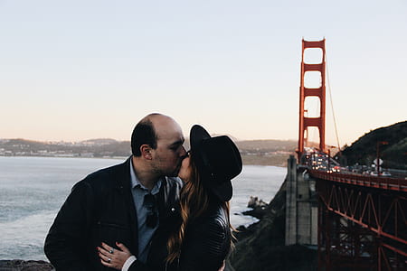 couple kissing on Golden Gate Bridge during daytime thumbnail