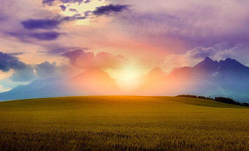 photo of sun set behind black mountains thumbnail
