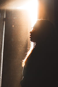 woman standing against sunlight thumbnail