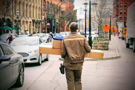 man wearing brown jacket during daytime thumbnail