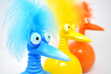 three assorted-color bird plastic toys thumbnail