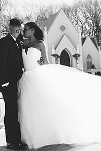 couple kissing near church thumbnail