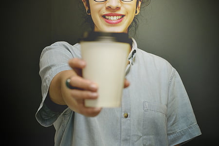 woman holding paper cup thumbnail