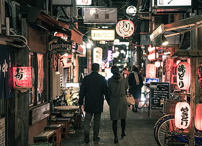 Couple Walking On Street At Night thumbnail