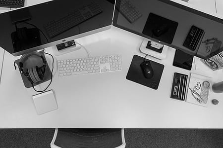 two computer monitors on desk thumbnail