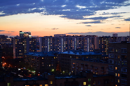 sunset over city buildings thumbnail
