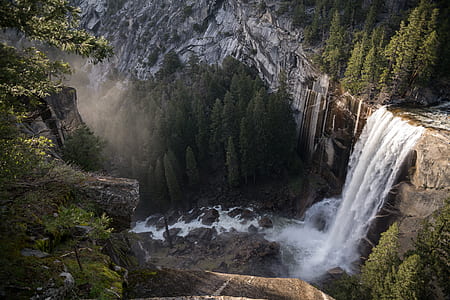 time-lapse photography of waterfalls surrounded with trees thumbnail
