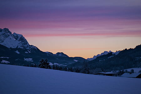 snow terrain under cloudy sky during daytime thumbnail