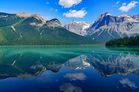green mountain surrounded by body of the water thumbnail