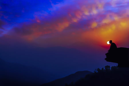 silhouette of man on cliff during dusk thumbnail