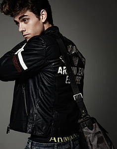 man wearing black leather jacket and black crossbody bag thumbnail