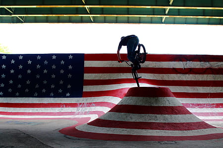 man riding on black bicycle thumbnail