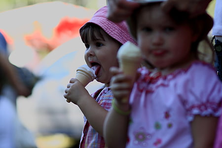 selective focus of girl eating ice cream thumbnail