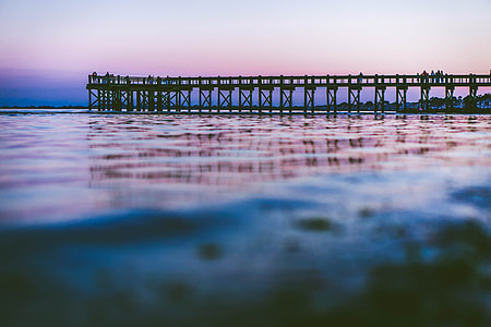 calm body of water with a dock thumbnail