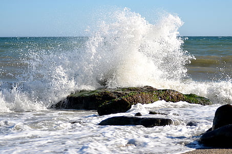 splash of water on rock photograph thumbnail