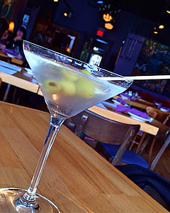 martini glass on wooden table thumbnail