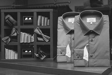 grayscale photography of two shirts and bows thumbnail
