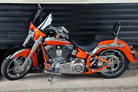 motorcycle parked beside roller shutter thumbnail