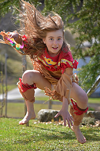 jumping girl wearing red shirt at daytime thumbnail