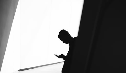 man sitting on building peak thumbnail