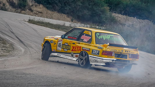 yellow vehicle on the road thumbnail