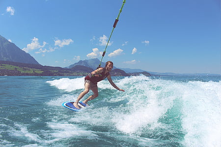 man wake boarding on sea wave thumbnail