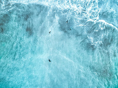aerial photo of people surfing on waves during daytime thumbnail