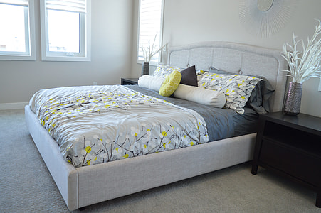 gray storage lift-up bed ; gray-green-black floral comforter with pillow thumbnail