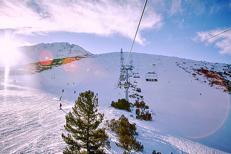 aerial photography of ski lift near people at daytime thumbnail