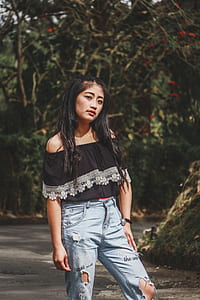 women's black off-shoulder blouse and distressed denim jeans thumbnail