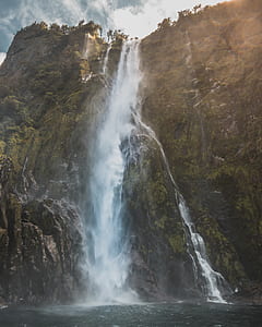 waterfalls during daytime thumbnail