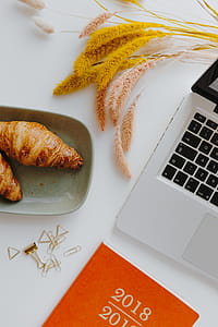 Female desk with orange notebook and pumpkins thumbnail